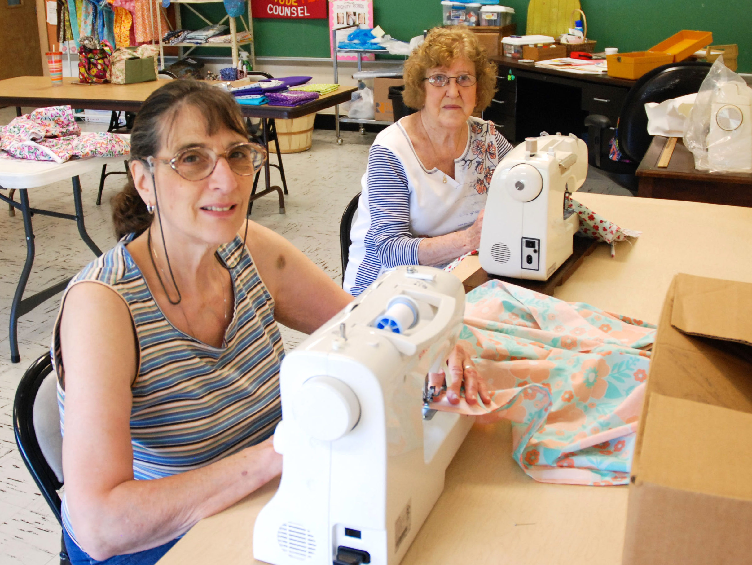 Making dignity robes - Mon Valley Independent