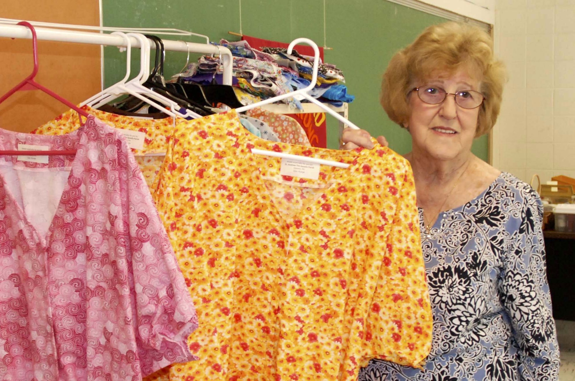 Volunteers produce dignity robes at St. Andrew the Apostle - Mon Valley ...